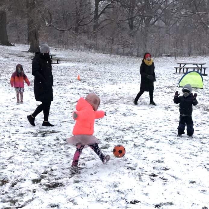 Children Playing Soccer in the Snow